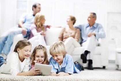 Three cute kids using a digital tablet. Three cute kids using a digital tablet.